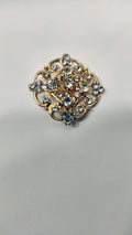 BROCHE METAL DORE ET CRISTAUX ZIRCONIUM